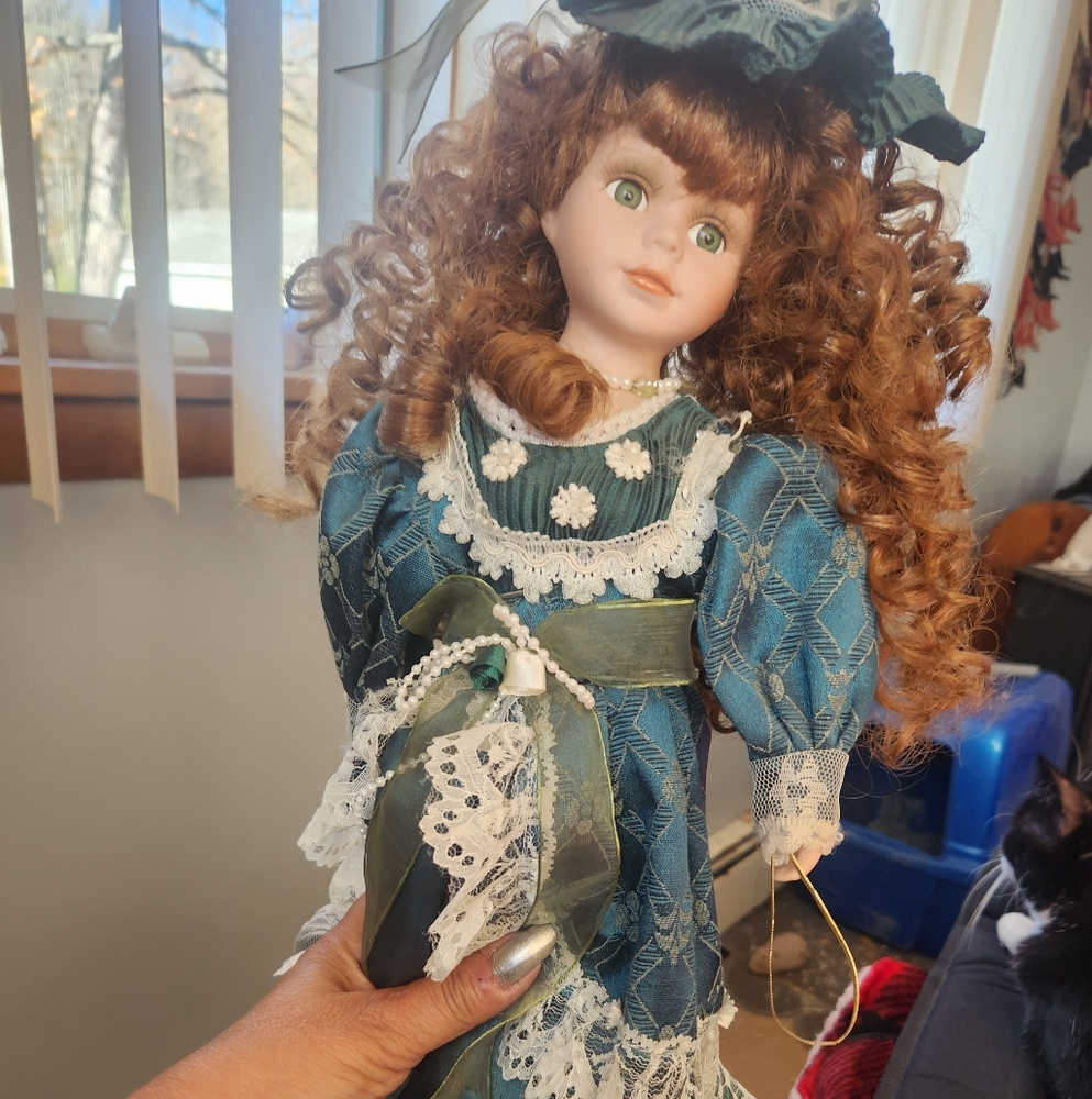 Elegant Porcelain Doll with Blue Dress and Lace Accents